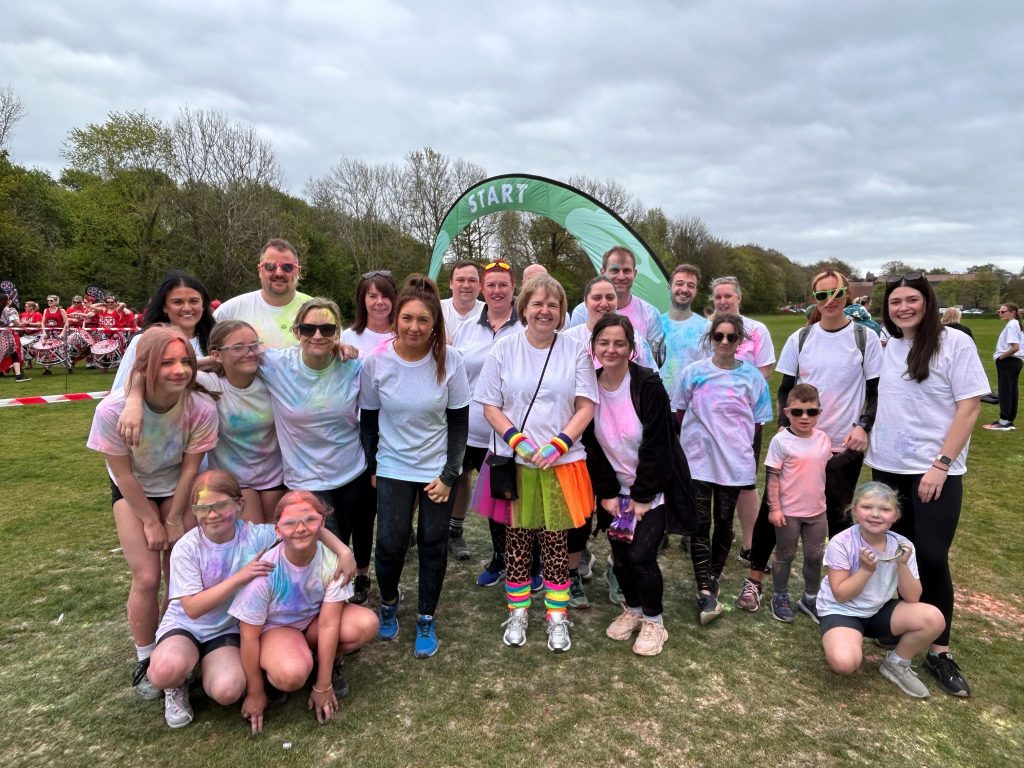 South Lakes Housing colleagues cross finish line at Kendal Colour Dash 2025
