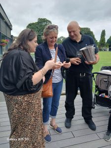 Colleagues drawing the raffle for Manna House